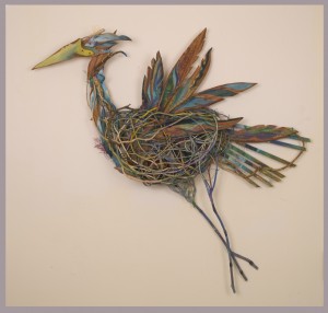 Bernice Davidson’s “Heron” is a mixed media piece that includes fiber, acrylic, sticks and wood.