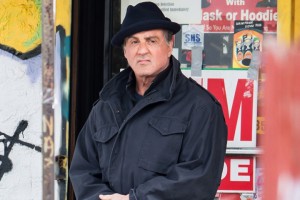 Sylvester Stallone films scenes of the new Rocky movie "Creed" in Philadelphia, PA. Sylvester Stallone's character Rocky Balboa is seen leaving a Bodega with newspaper in hand. Pictured: Sylvester Stallone Ref: SPL939364 060215 Picture by: Gilbert Carrasquillo/Splash News Splash News and Pictures Los Angeles:310-821-2666 New York:212-619-2666 London:870-934-2666 photodesk@splashnews.com 