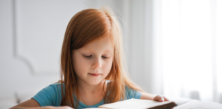 WCS COVID-19 Isolation and Quarantine Numbers by School child reading book