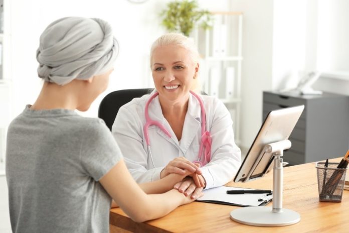 Woman after chemotherapy visiting doctor in hospital