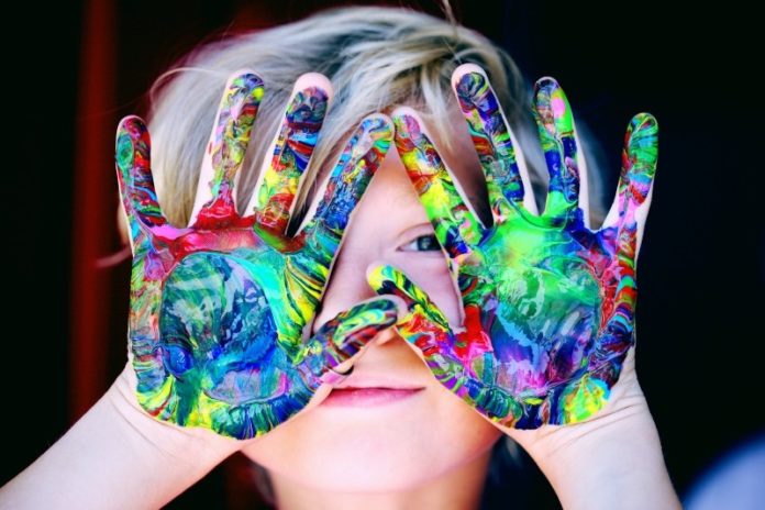 child with painted hands stock image