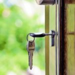 Keys and lock the door on the background of solar garden