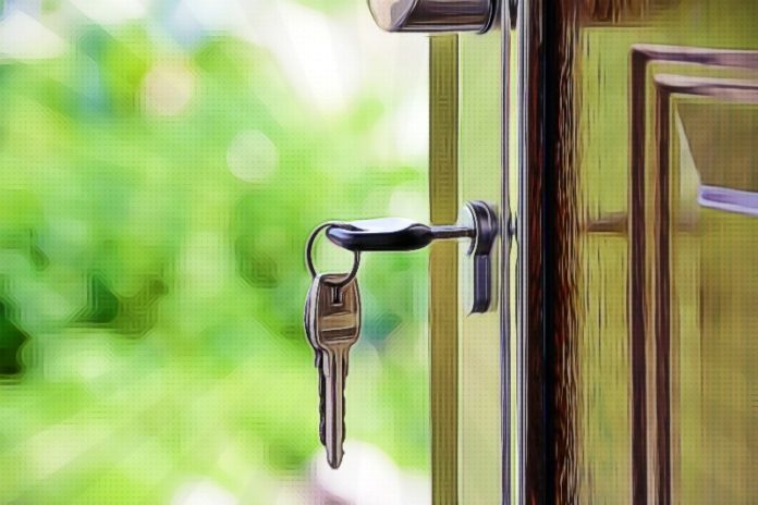 Keys and lock the door on the background of solar garden